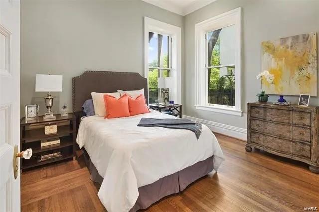 bedroom with hardwood / wood-style floors