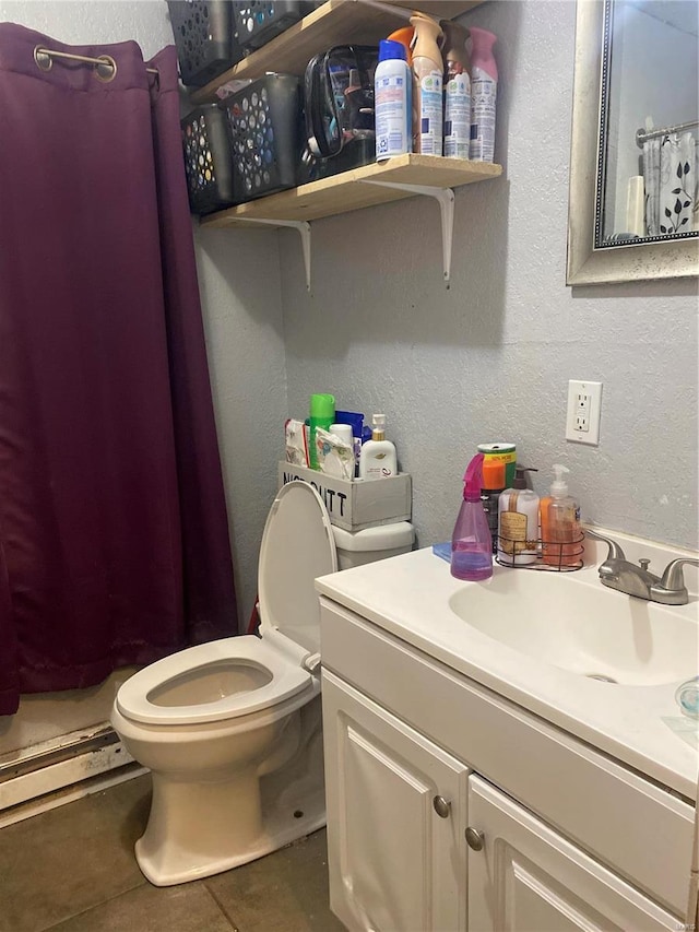 bathroom with vanity, a baseboard heating unit, tile patterned floors, a shower with curtain, and toilet