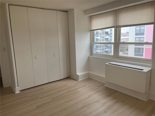 unfurnished bedroom featuring light hardwood / wood-style floors