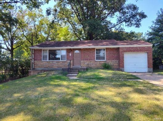 single story home with a front yard and a garage