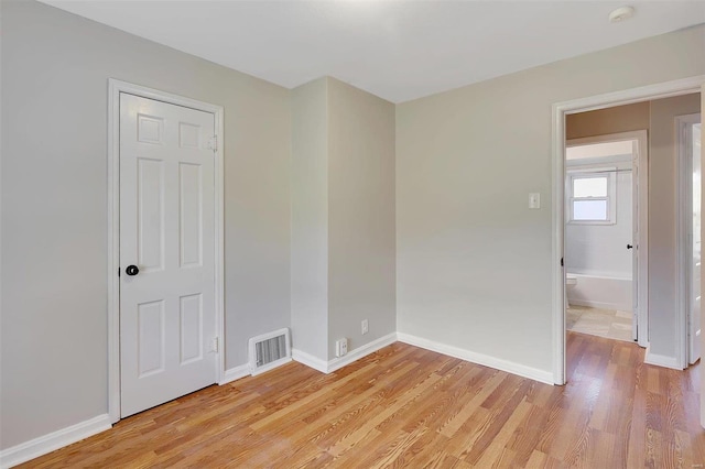 empty room with light wood-type flooring