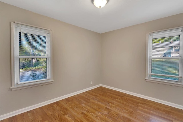 spare room featuring hardwood / wood-style floors