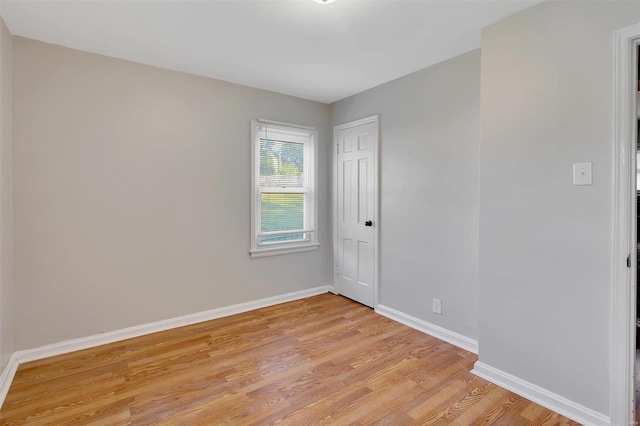 spare room with light wood-type flooring