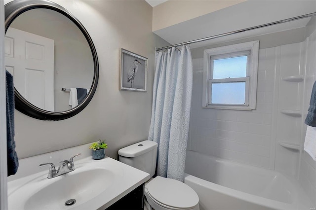 full bathroom featuring shower / bath combo with shower curtain, vanity, and toilet