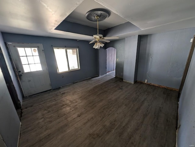 interior space with dark hardwood / wood-style floors and ceiling fan