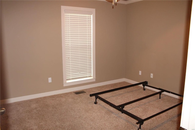 unfurnished room with carpet flooring