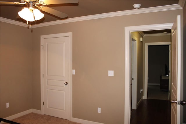 interior space with crown molding and ceiling fan