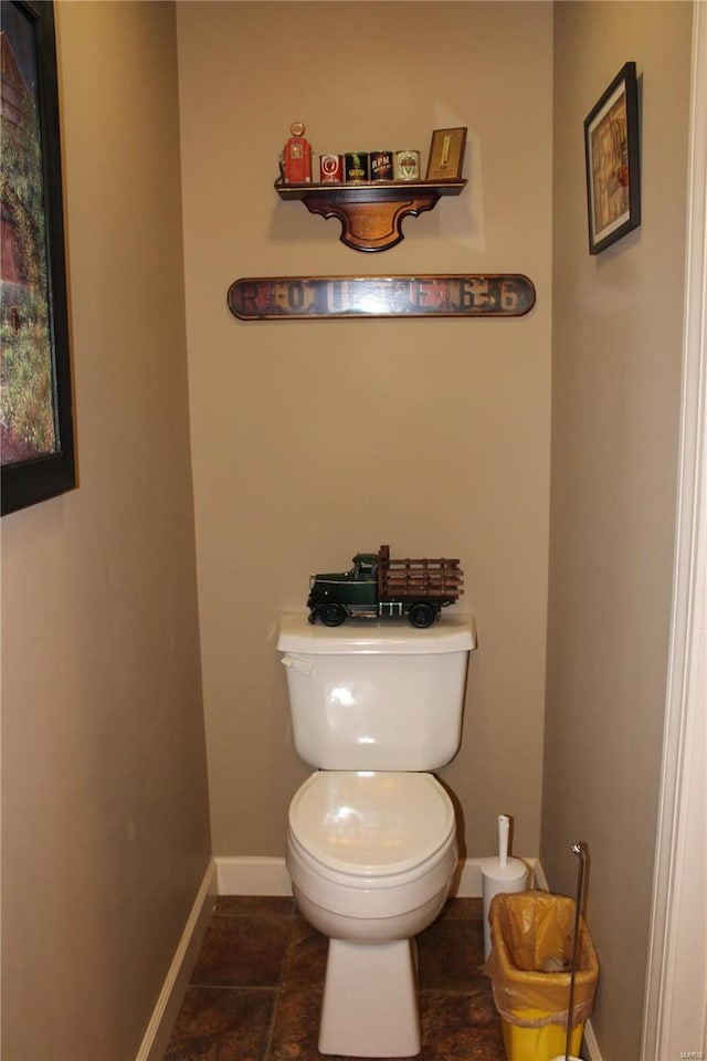 bathroom with toilet and tile patterned floors