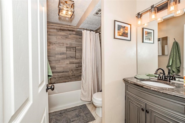 full bathroom featuring vanity, a textured ceiling, shower / bath combo with shower curtain, tile patterned floors, and toilet