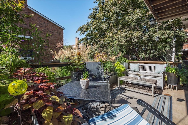 deck with outdoor lounge area and a patio