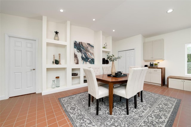 dining room featuring built in shelves and tile patterned floors