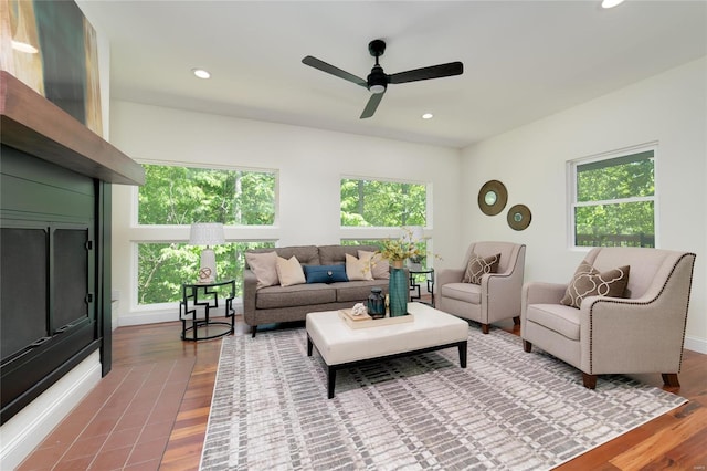 living room with ceiling fan and hardwood / wood-style floors