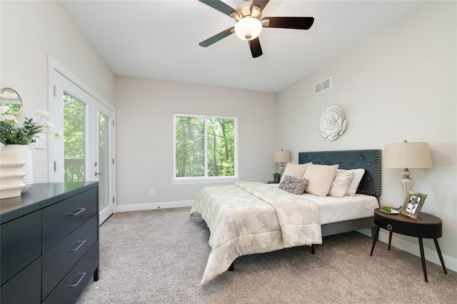 carpeted bedroom with ceiling fan and access to exterior