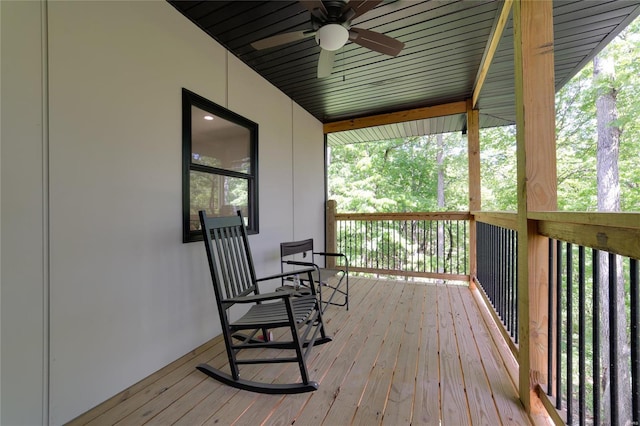 wooden deck with ceiling fan