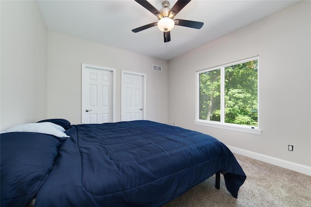 carpeted bedroom with ceiling fan