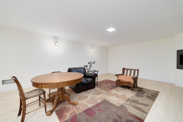 living area with light hardwood / wood-style flooring