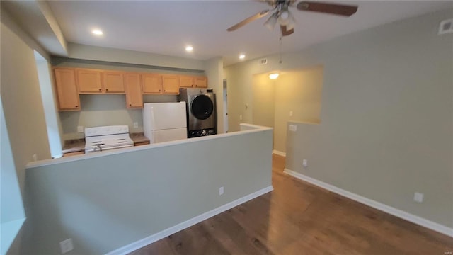 kitchen with ceiling fan, dark hardwood / wood-style floors, stacked washer / dryer, white appliances, and light brown cabinetry