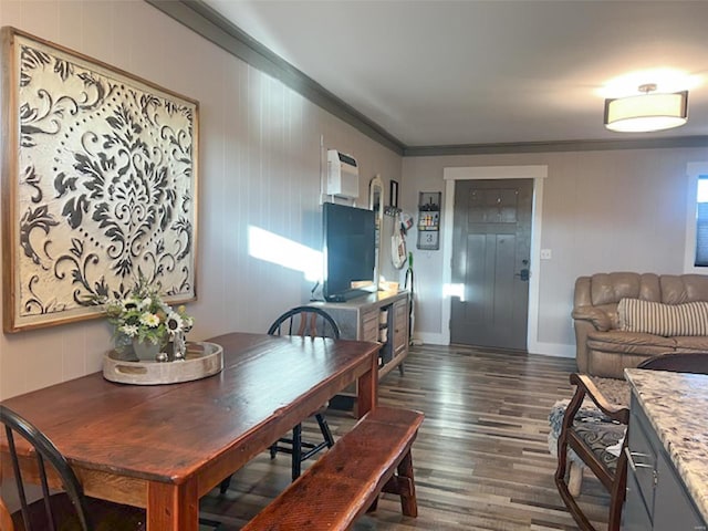 dining space featuring dark hardwood / wood-style floors and ornamental molding