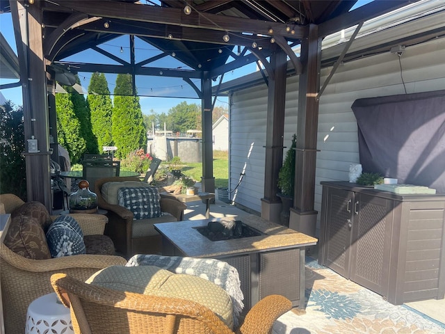 view of patio / terrace featuring an outdoor living space with a fire pit