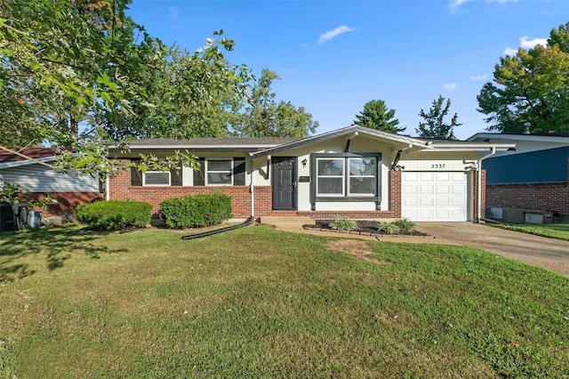 ranch-style home with a front lawn and a garage