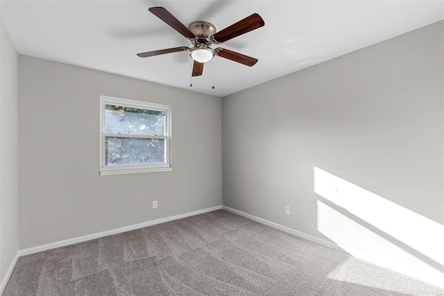 unfurnished room with ceiling fan and carpet floors