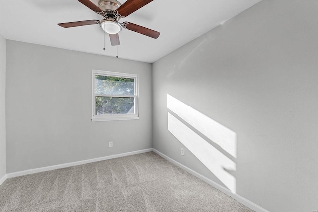 empty room featuring ceiling fan and carpet floors