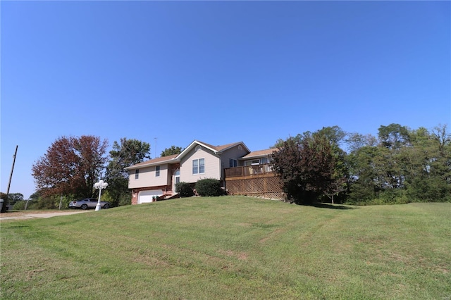 view of front of property with a garage and a front yard