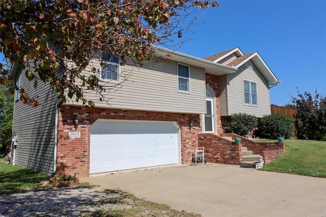 raised ranch featuring a garage