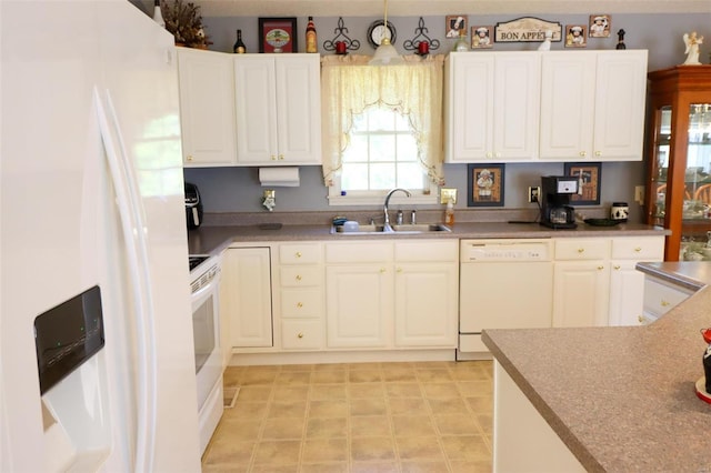 kitchen with white cabinets, white appliances, and sink