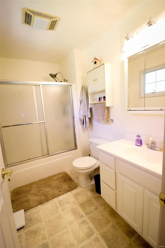 full bathroom with toilet, vanity, and combined bath / shower with glass door