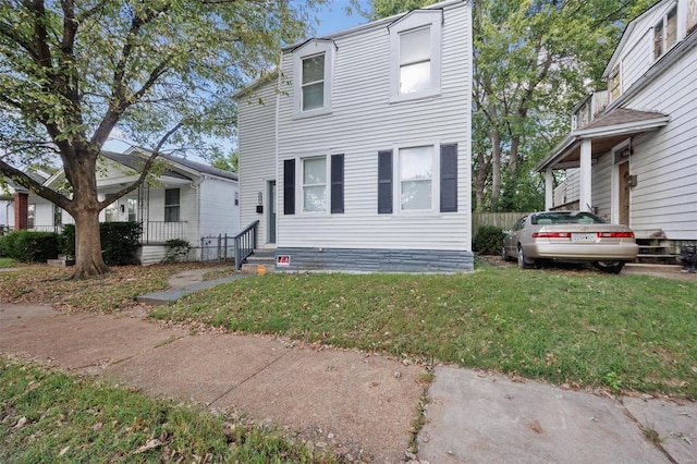 view of front of property with a front lawn