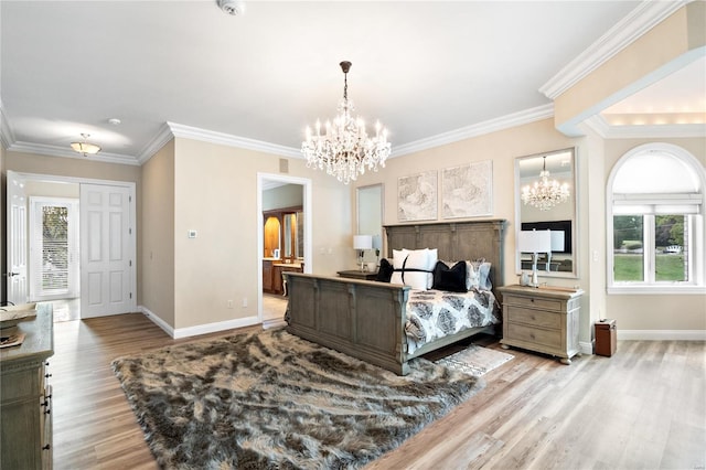 bedroom featuring ornamental molding, connected bathroom, and light hardwood / wood-style flooring