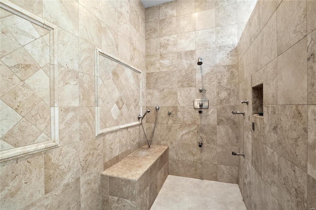 bathroom featuring a tile shower