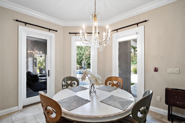 dining area with crown molding and a chandelier