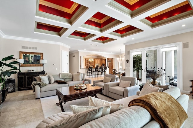 living room featuring coffered ceiling, crown molding, beam ceiling, and an inviting chandelier