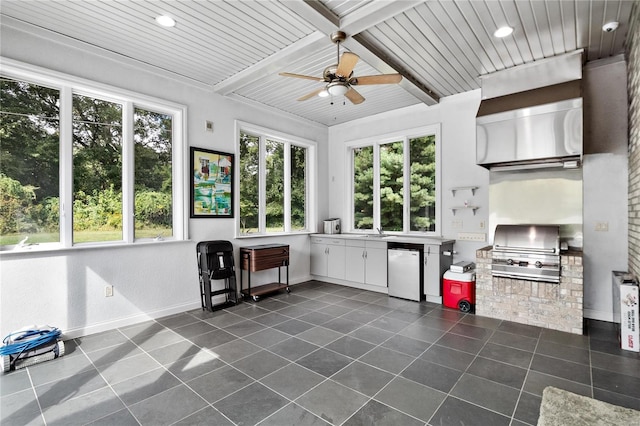 sunroom with wooden ceiling, beam ceiling, and a wealth of natural light