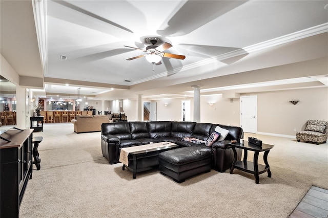 carpeted living room featuring ceiling fan, a raised ceiling, and crown molding