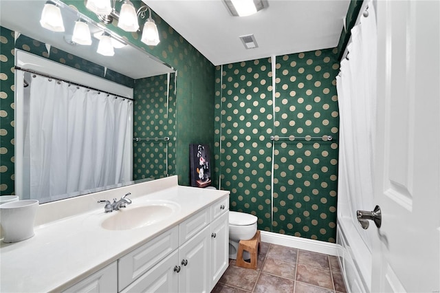 bathroom with vanity, tile patterned flooring, toilet, and curtained shower