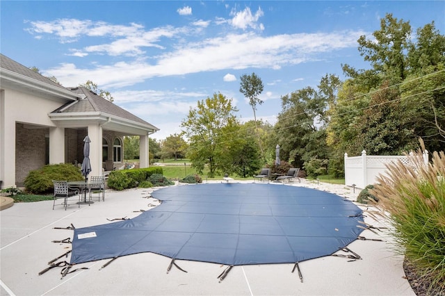 view of swimming pool featuring a patio