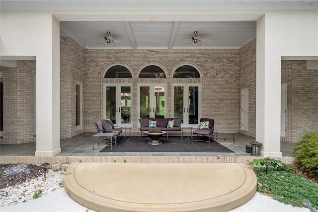 view of patio featuring ceiling fan and french doors