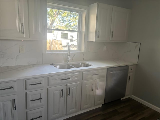 kitchen featuring white cabinetry, dishwasher, sink, dark hardwood / wood-style flooring, and decorative backsplash