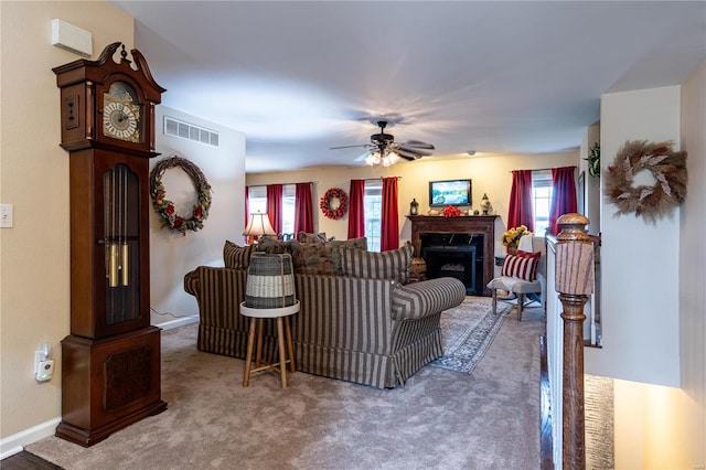 living room with carpet and ceiling fan