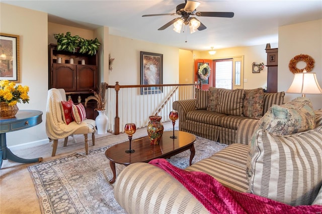 carpeted living room featuring ceiling fan