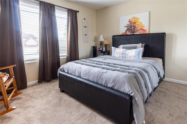 bedroom with light colored carpet