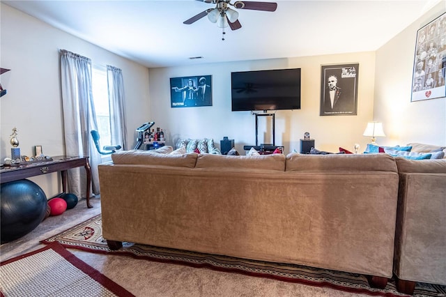 living room featuring carpet floors and ceiling fan