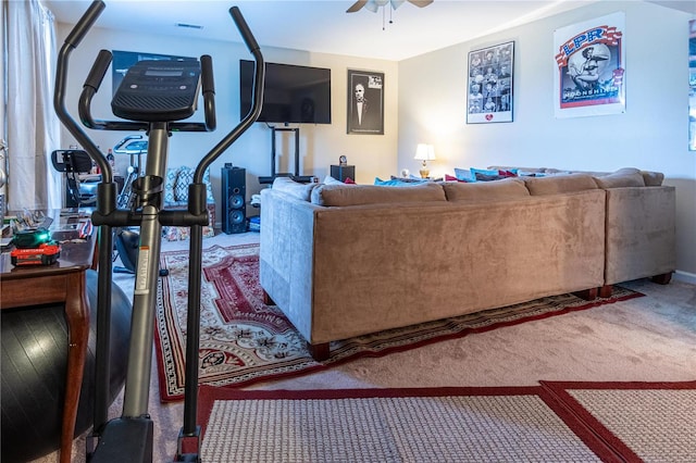 living room featuring carpet floors and ceiling fan