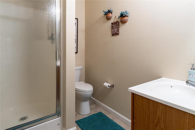 bathroom with tile patterned flooring, a shower with door, toilet, and vanity