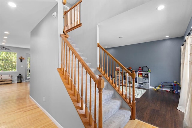 staircase featuring hardwood / wood-style flooring