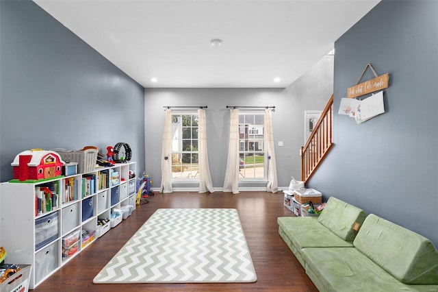 recreation room with dark hardwood / wood-style floors