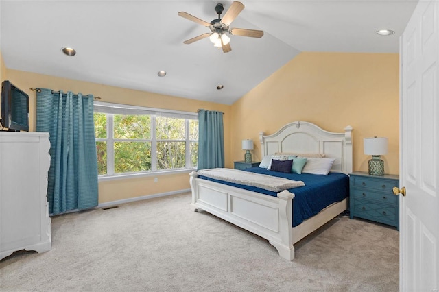 bedroom featuring ceiling fan, light colored carpet, and lofted ceiling